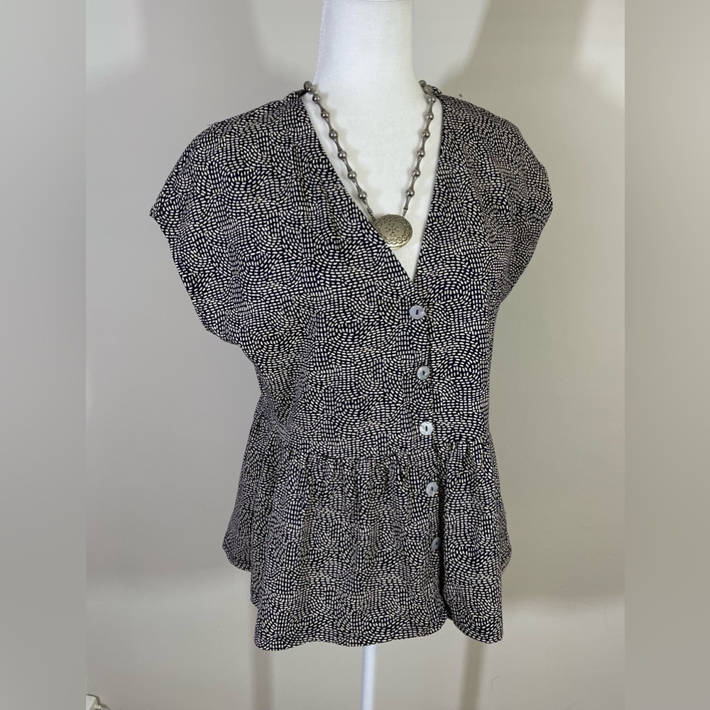 Next sz 10 top in a silky feel fabric black with white with a peplum button down